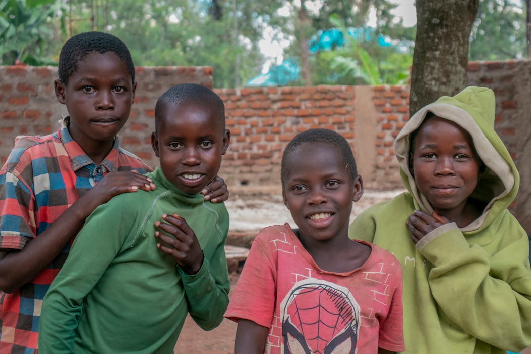 Ugandan mother with children grateful for donation support